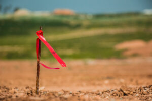 Property line marker dividing plot lines.