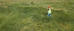 topography land surveyor taking field measurements