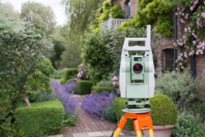 land surveying device directed toward residential property