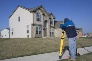 surveyor performing residential land survey