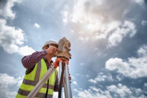 surveyor-uses-digital-level-at-construction-site